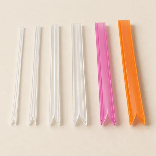 Press to close zipper profile samples in 3 mm, 10 mm and 12 mm, in natural, pink and orange.